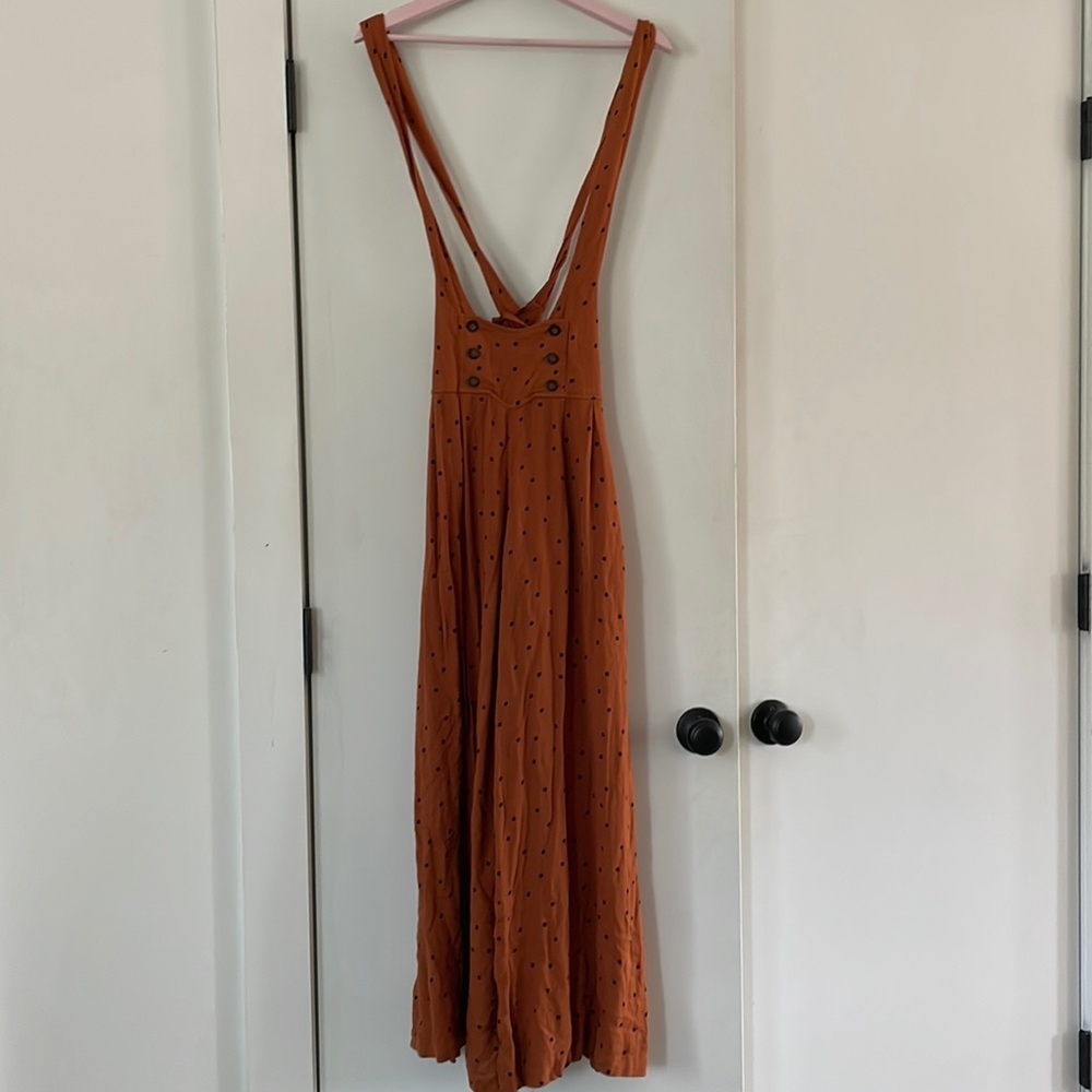 Free People rust colors jumper with black polka dots and suspenders